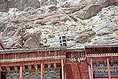 Ladakh - Hemis Gompa, projecting roofs in deep red 